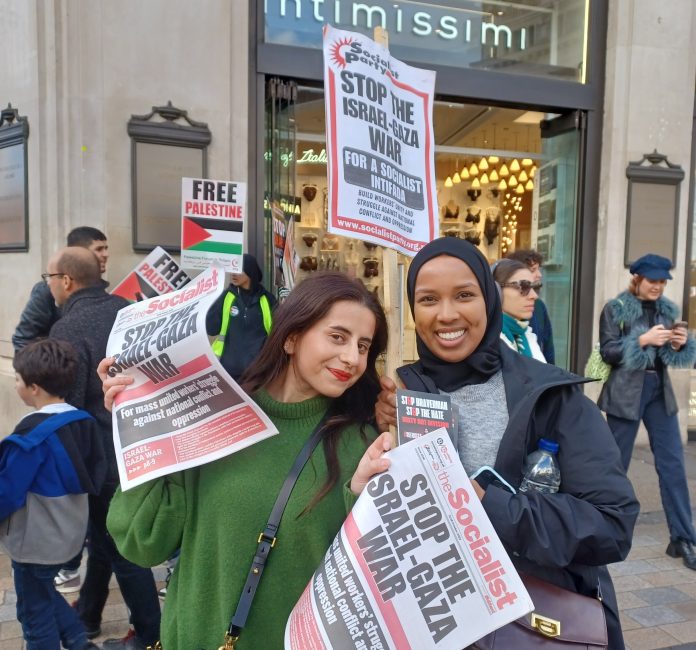 Protesters with Socialist Party material on the London demo. Photo: Adam Powell-Davies