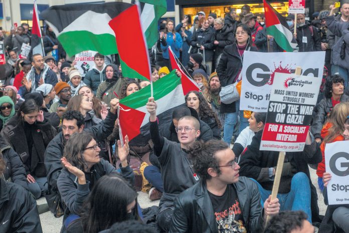 Sit-down protest at Charing Cross station. Photo: Paul Mattsson