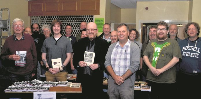 Rob Owen (centre) with his pamphlet on West Wales workers' struggles. Photo: Socialist Party Wales