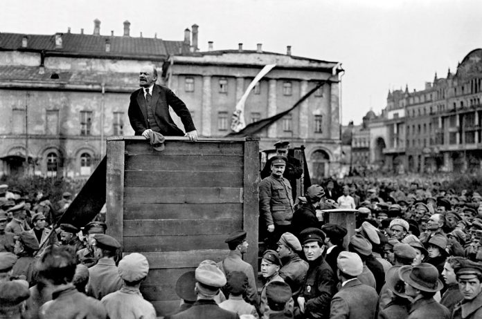 Lenin flanked by Trotsky addressing a demonstration in Moscow, May 1920.