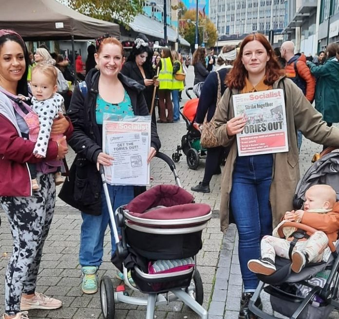 Birmingham-scaled-1 Socialist Party members including Corinthia (right) on the 'March of the Mummies' protest against Tory childcare plans. Photo: Birmingham SP