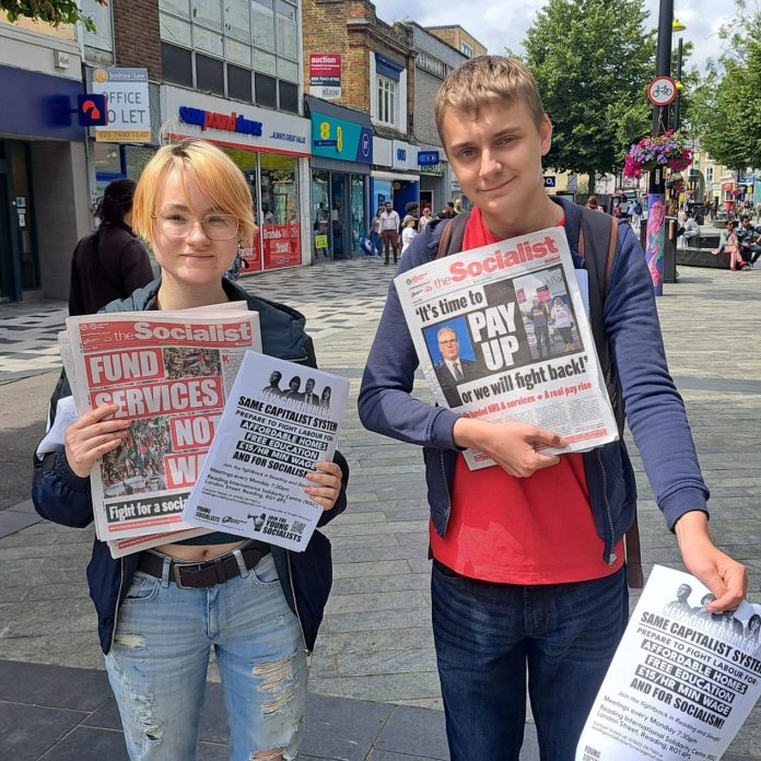 Rhys (left) campaigning in Reading. Photo: Reading SP