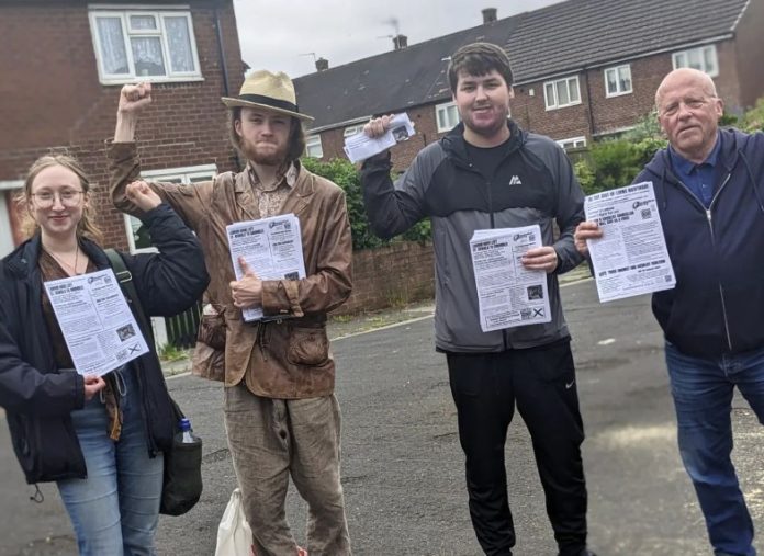Conor (second left) out Campaigning. Photo: Liverpool Socialist Party