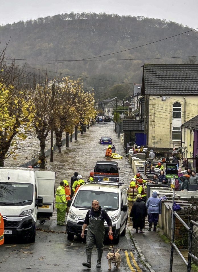 This scene of chaos underscores the urgent need for action, as rescue teams wade through waterlogged streets to ensure public safety. Photo: Nikoki Weerakoon