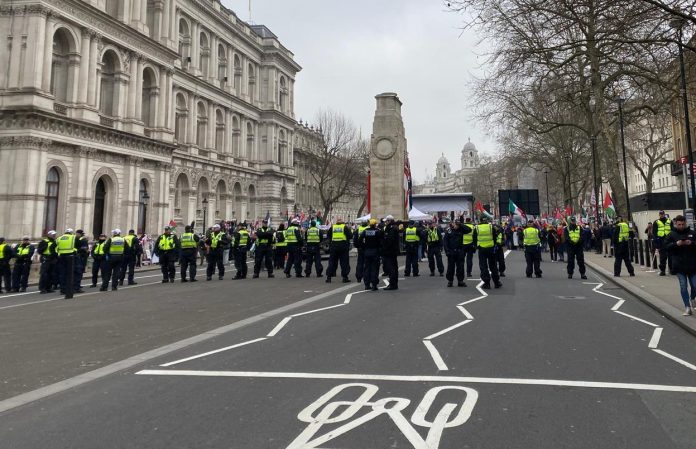 One of the multiple police lines at the demonstation. Photo: Paula Mitchell