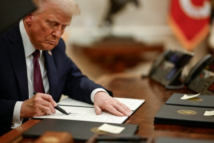 Donald Trump signing executive orders. Photo: White House/Public Domain