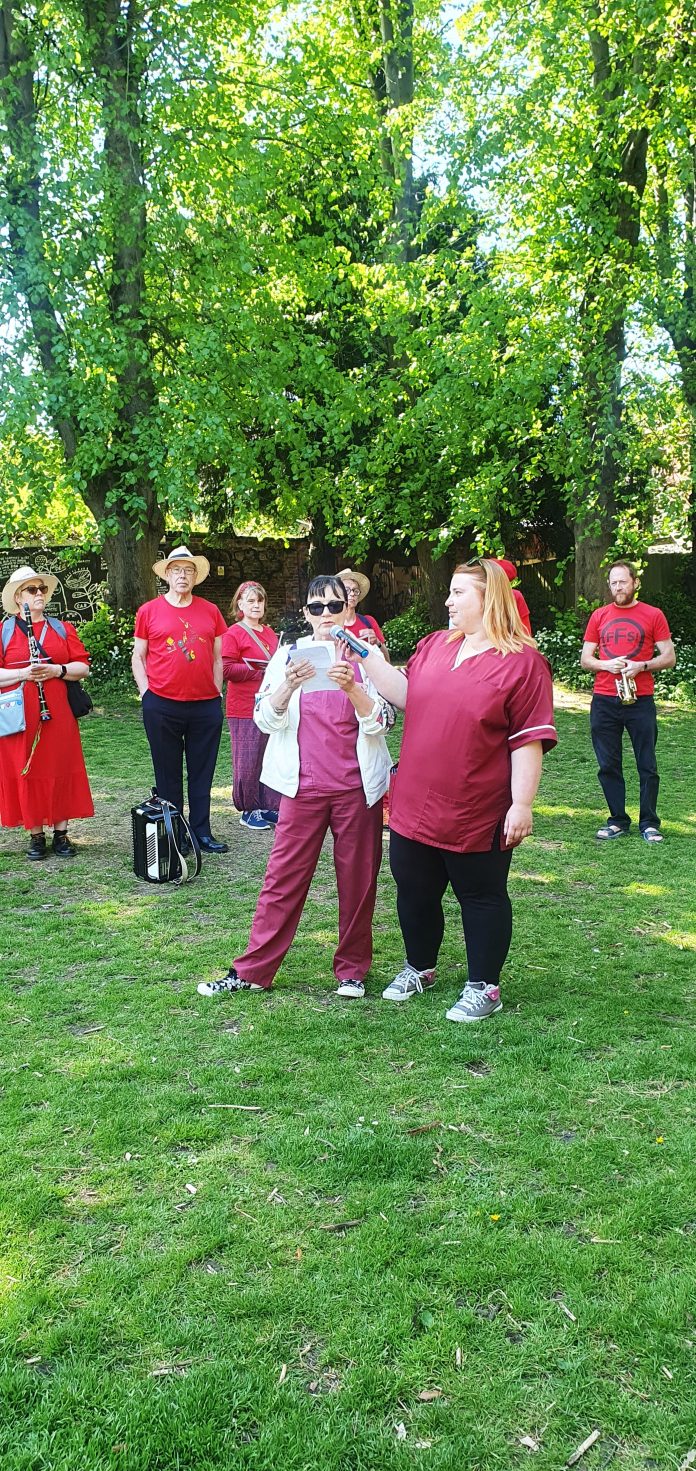 Phlebotomist strikers speaking at May Day event. Photo: Chris Moore