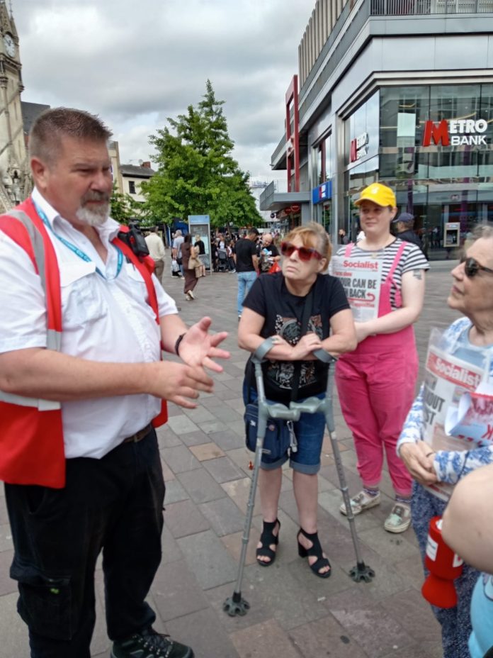 502547122_10235864291418442_4019985605810183632_n Heather (right) being fined by the council for campaigning. Photo: Leicester SP