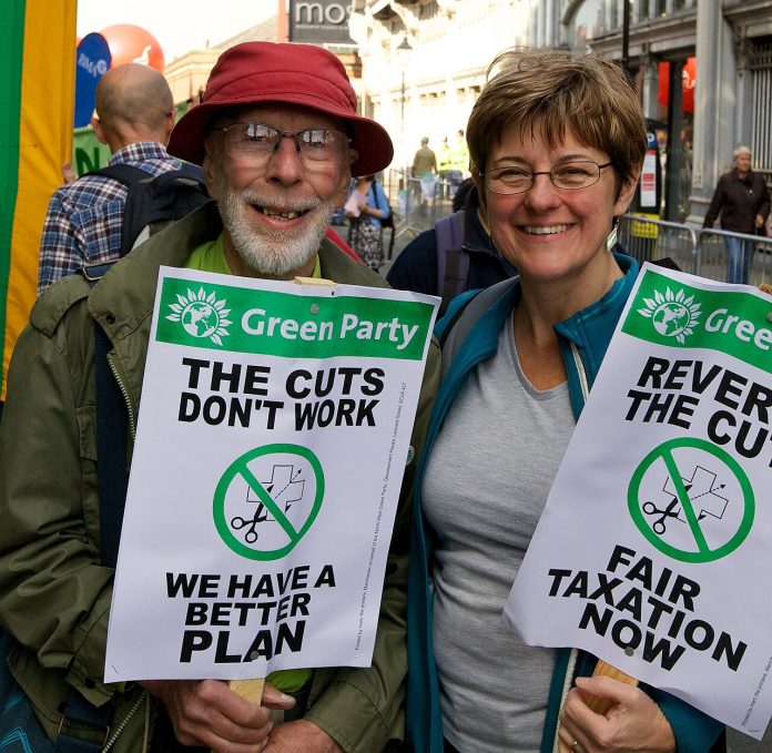 BinaryApe_-_10090523704 Green Party members protesting against cuts under the Tory-Lib Dem coalition government in 2012 Photo: Pete Birkinshaw/CC