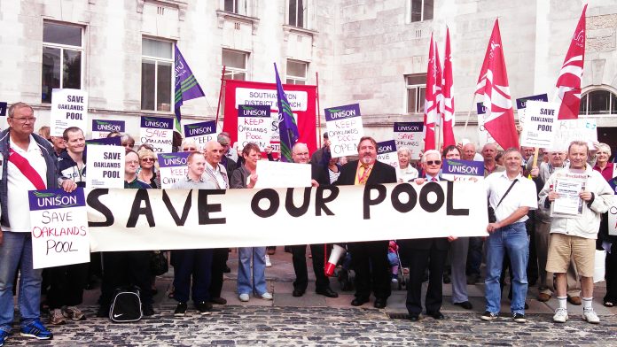 Don Thomas (centre) at a protest against the closure of Oaklands swimming pool
