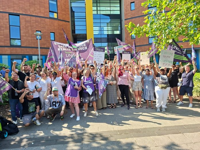 Manchester strike June NHS workers in Manchester on strike over pay banding, one of many that have taken place nationally Photo: Manchester SP